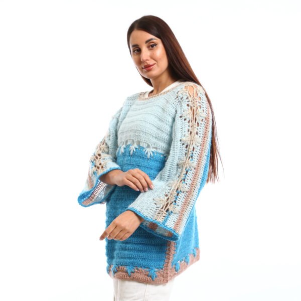 Handmade crocheted blouses in shades of light blue and turquoise, featuring flared sleeves, decorative stitching, and a textured knit design,