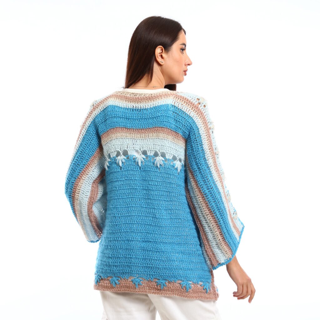 Handmade crocheted blouses in shades of light blue and turquoise, featuring flared sleeves, decorative stitching, and a textured knit design,