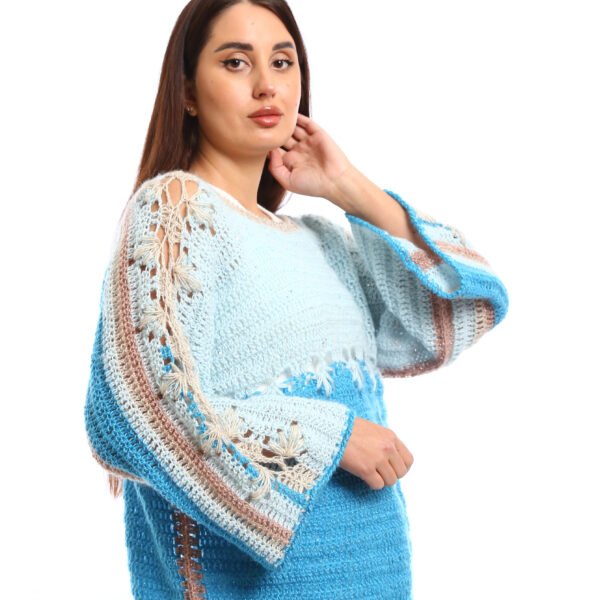 Handmade crocheted blouses in shades of light blue and turquoise, featuring flared sleeves, decorative stitching, and a textured knit design,