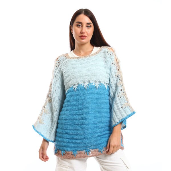 Handmade crocheted blouses in shades of light blue and turquoise, featuring flared sleeves, decorative stitching, and a textured knit design,