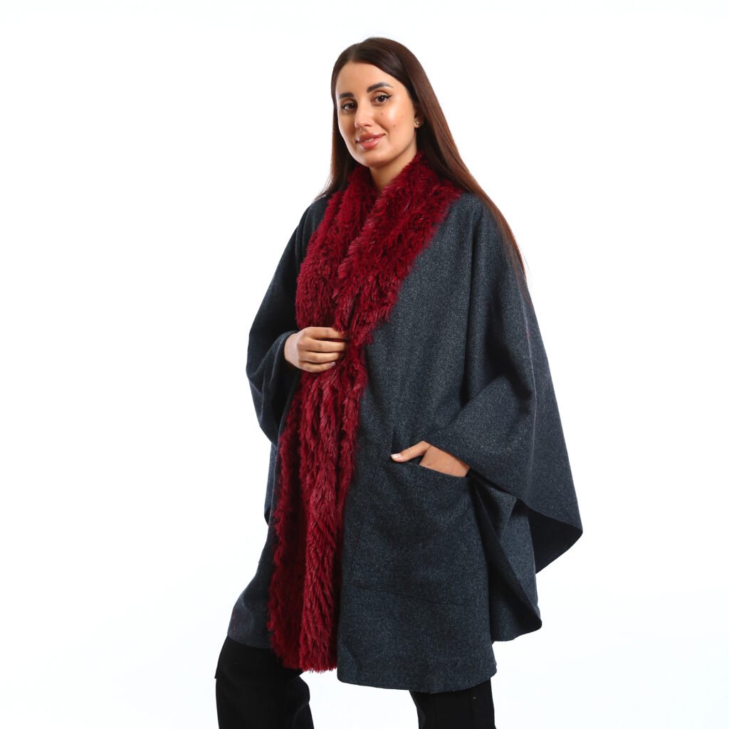 Elegant winter look featuring a Navy oversized Cap with wide sleeves, the deep burgundy faux-fur scarf adds warmth, texture and pocket patch