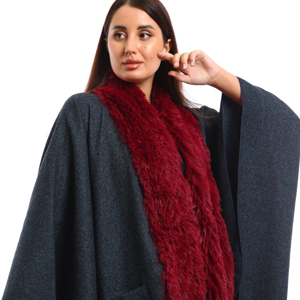 Elegant winter look featuring a Navy oversized Cap with wide sleeves, the deep burgundy faux-fur scarf adds warmth, texture and pocket patch