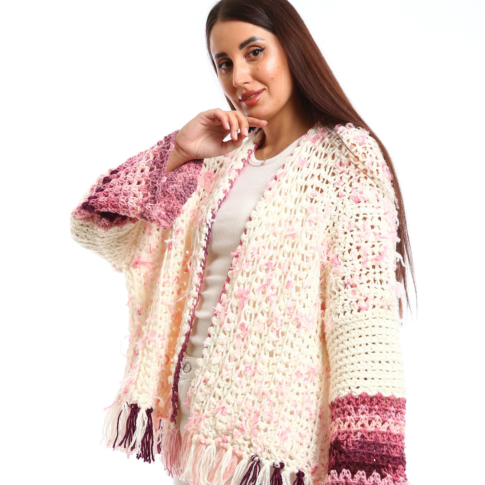 Handmade-looking crocheted open cardigan.is primarily cream-colored with pink featuring wide sleeves with color-blocked bands near the cuffs. - Image 2