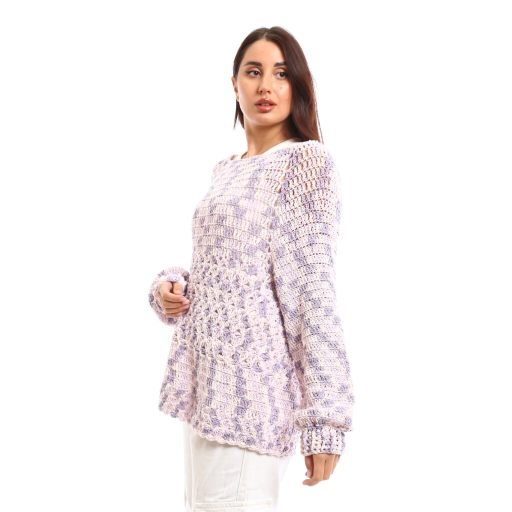 Handcrafted crochet pullover design with an airy, open-knit texture It comes in soft pastel shades of lavender blended with white