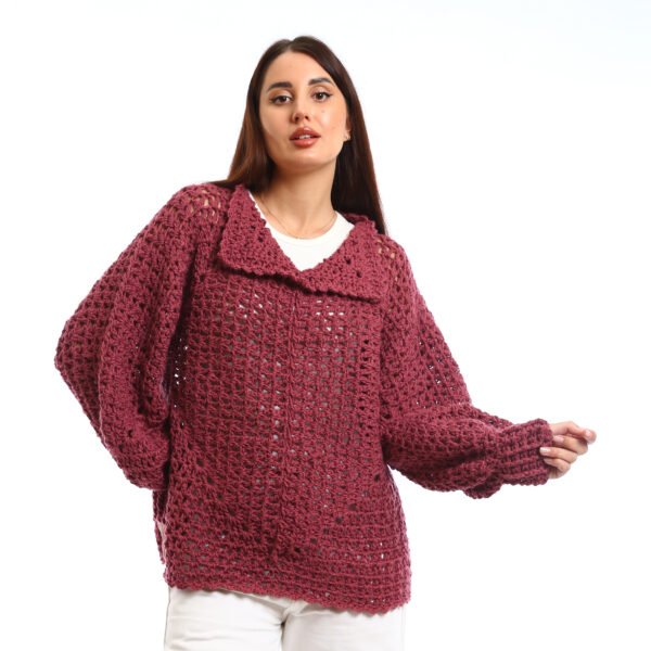 Handcrafted crocheted pullover in a rich burgundy tone. It features an open, textured stitch relaxed sleeves with slightly flared cuffs and a wide