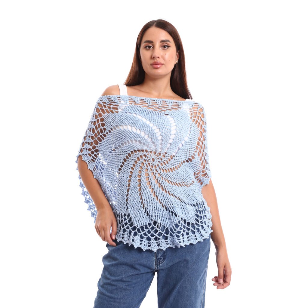 A delicate light blue crochet poncho handmade