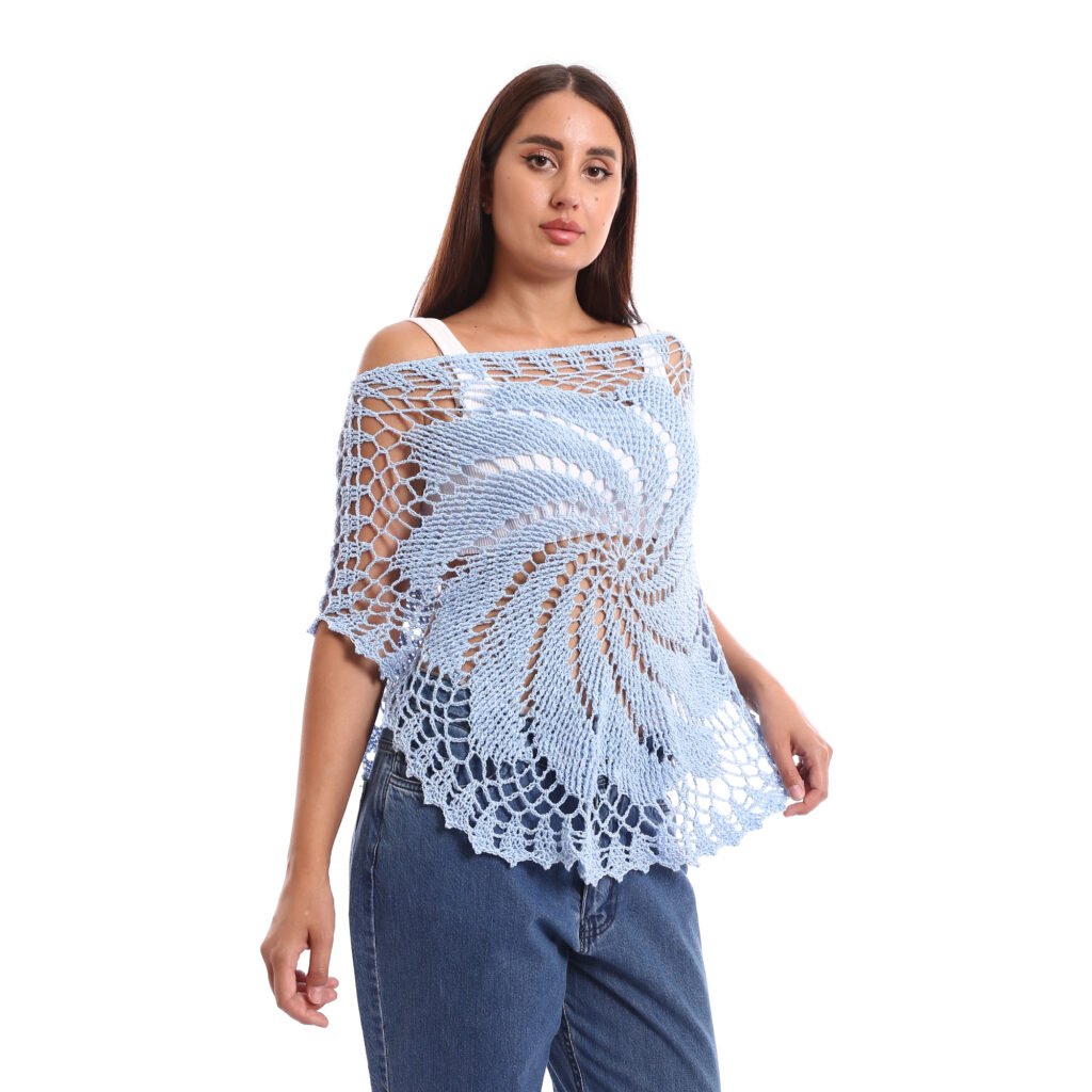 A delicate light blue crochet poncho handmade