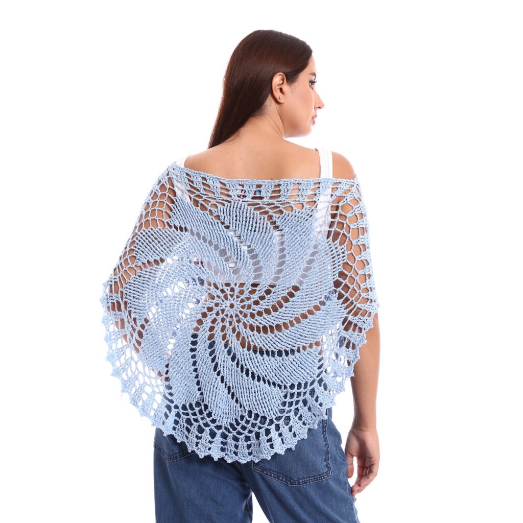 A delicate light blue crochet poncho handmade