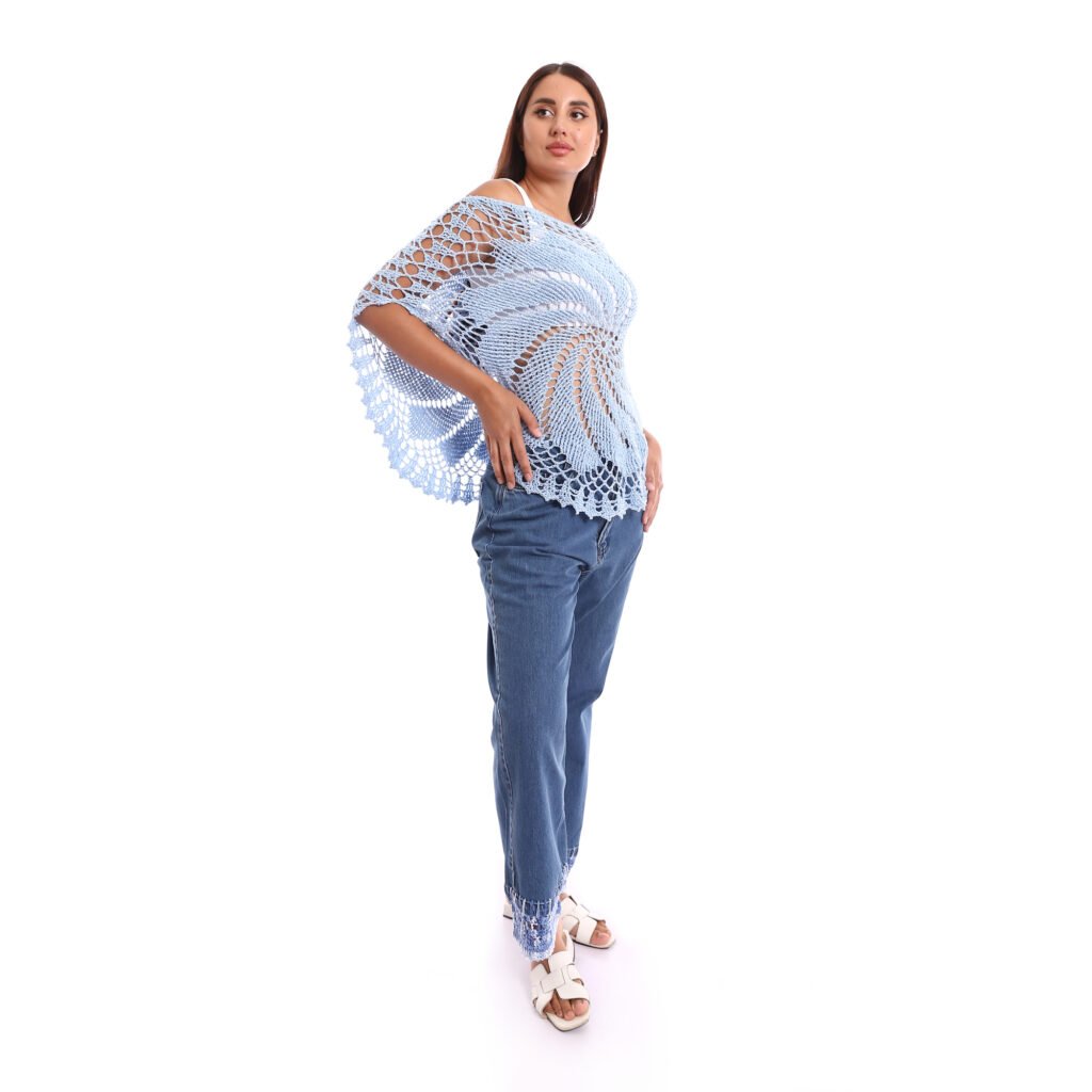 A delicate light blue crochet poncho handmade