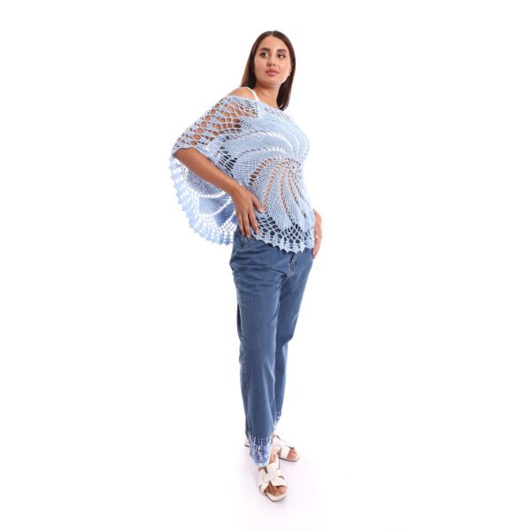 A delicate light blue crochet poncho handmade