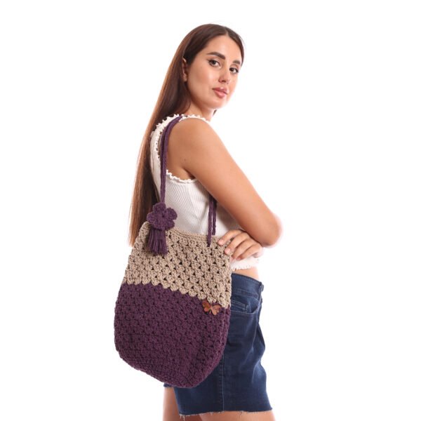 A handcrafted crochet tote bag featuring a two-tone